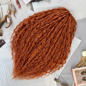 May include: A set of three ceramic mugs with a speckled, matte finish. The mugs are in shades of cream, light gray, and dark gray. Each mug has a simple, minimalist design and a rounded handle.