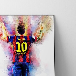 May include: A watercolor painting of a soccer player wearing a red and blue jersey with the number 10 and the name "Messi" on the back. The player is raising both arms in the air, celebrating a goal. The background is a colorful abstract design.