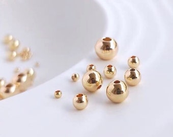 Perles en laiton rondes lisses plaquées or véritable 14K de haute qualité