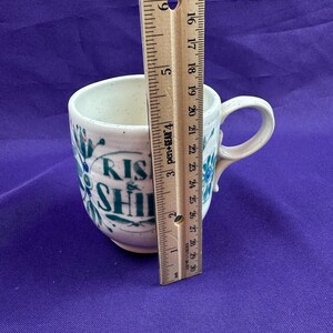 May include: A set of three ceramic nesting bowls in graduating sizes. The bowls are white with a speckled, textured finish and a slightly flared rim. The largest bowl measures approximately 8 inches in diameter.