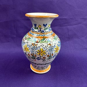 May include: A rustic wooden sign with the text "Welcome to our home" in white lettering. The sign features a distressed finish and a simple, inviting design, perfect for front door decor.