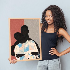 May include: A rectangular framed wall art piece featuring a silhouette of two figures embracing. The background is split vertically between a textured terracotta red and a light grey. The foreground figure wears a shirt with a light blue and peach floral pattern.
