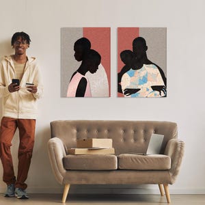 May include: Two rectangular wall art prints featuring stylised silhouettes of people against a split background of textured grey and solid coral. The left print shows a person in a pink top, while the right print depicts a person in a floral shirt.