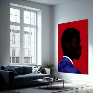 May include: A large, rectangular canvas art piece featuring a profile portrait of a person against a vibrant red background. The person is wearing a blue blazer with a red heart pattern. The artwork is displayed in a modern living room setting.