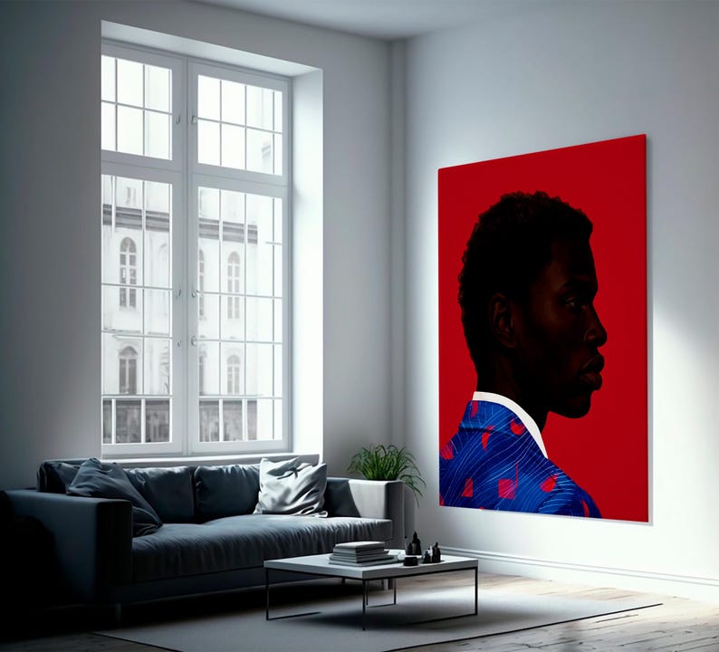 May include: A large, rectangular canvas art piece featuring a profile portrait of a person against a vibrant red background. The person is wearing a blue blazer with a red heart pattern. The artwork is displayed in a modern living room setting.