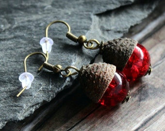 Red glass beads under acorn caps, handmade acorn earrings made of red glass beads, bronze