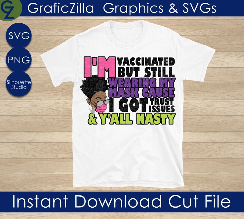 May include: A white t-shirt with a graphic design featuring a cartoon woman wearing a face mask. The text on the shirt reads "I'm vaccinated but still wearing my mask cause I got trust issues & y'all nasty".