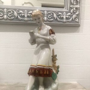 Home art deco.Ukrainian girl in national dress. Porcelain figurine of the Ukrainian factory of the USSR period.Vintage souvenir from Ukraine