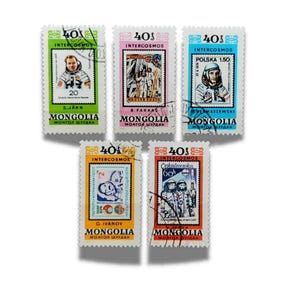 May include: A collection of five postage stamps from Mongolia, featuring images of astronauts and space-related themes. Each stamp has a different design and color scheme, with text in English and Cyrillic script. The stamps are labeled "INTERCOSMOS" and "MONGOLIA".