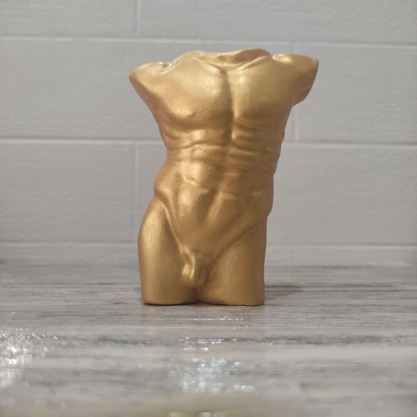 Statue figure of a naked male torso of a body made of sculptural plaster made by hand.Art home decor. Ukrainian handmade