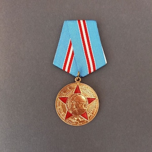 The jubilee medal &quot;50 Years of the Armed Forces of the USSR&quot;  to commemorate the 50th anniversary of the Armed Forces of the USSR.