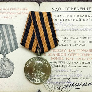 The original medal of the Ukrainian veteran of World War II period of the USSR Award of a Red Army veteran + original award document  1946