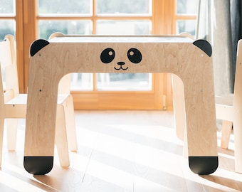Mesa de actividades multifuncional para niños: diseño inspirado en Montessori con superficie de pizarra y espacio de almacenamiento para un juego creativo.