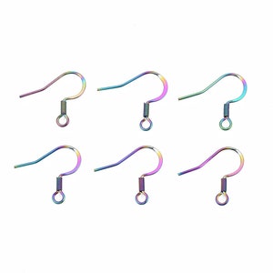 May include: Six iridescent rainbow-colored earring hooks. Each hook features a curved design with a spring and a small loop at the bottom. The hooks are made of metal and have a shiny, colorful finish, reflecting various hues.