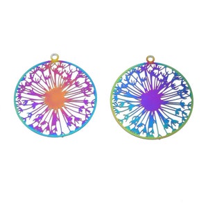 May include: Two iridescent metal dandelion pendants. Each pendant is circular with a detailed cutout design of a dandelion seed head. The colors shift from purple to blue, green, and orange. Each pendant has a small loop at the top for hanging.