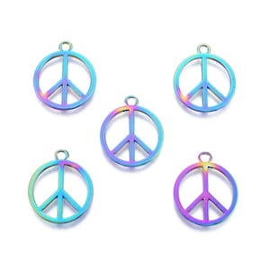 May include: Five iridescent peace sign charms. Each charm features a circular outline with a vertical line and three diagonal lines inside. The charms have a small loop at the top for attaching to jewelry or other crafts.
