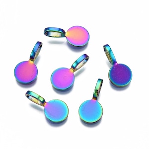 May include: Six iridescent metal charms with a circular base and a loop. The charms display a spectrum of colors, including purple, blue, and gold. The charms are designed for jewelry making or crafting.