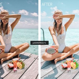 May include: A split-screen comparison showing a white one-piece swimsuit with a lace-up front and scalloped edges. The subject holds a halved dragon fruit, with a plate of tropical fruit including mango and dragon fruit slices on a wooden deck.