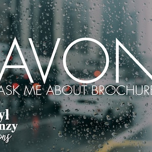May include: A white text graphic on a blurry background of a city street with raindrops on a window. The text reads "AVON ASK ME ABOUT BROCHURE" and "Vinyl Frenzy Creations".