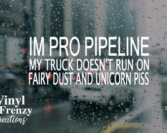 May include: A white vinyl sticker with the text "IM PRO PIPELINE MY TRUCK DOESN'T RUN ON FAIRY DUST AND UNICORN PISS" on a blurry background of a rainy city street.