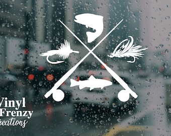 May include: White vinyl decal with a crossed fishing rod design. The design includes a fish, two flies, and a reel. The text "Vinyl Frenzy Creations" is below the design.