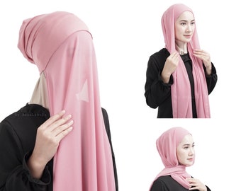 May include: A pink hijab, a traditional head covering, is shown in multiple views. The fabric drapes softly, with a light, airy appearance. The hijab is worn in different styles, showcasing its versatility and design.