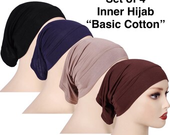May include: Set of four inner hijabs in black, navy blue, tan, and brown. The text on the image reads "Set of 4 Inner Hijab 'Basic Cotton'". The hijabs are displayed on mannequin heads.