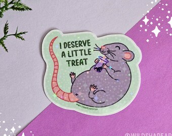 May include: A sticker featuring a cartoon rat with a pink tail, holding a cup of boba tea. The rat is sitting on a green background with glitter and the text "I deserve a little treat" in white.