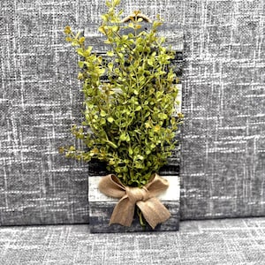 Farmhouse Wall Hanging Rustic Wood Design Modern Home Accent Painted Slats Gray Black White Finish Burlap Bow Detail Faux Greenery Accent Handmade Wall Art Country Style Decoration Neutral Color Scheme Small Space Solution Jute Rope Hanger