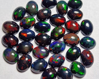 Ópalo negro etíope natural, cabujón ovalado, calibrado de 3 x 5 mm a 8 x 10 mm, ópalo de fuego arcoíris, fabricación de ópalo de fuego múltiple para joyería.