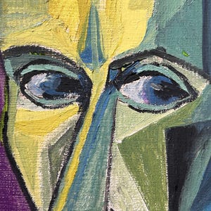 May include: A close-up of a painting of a face with blue eyes and a yellow, green, and blue color scheme.