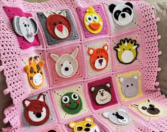 May include: A pink crocheted baby blanket with a variety of animal faces in different colors. The blanket has a crocheted border with a fringe.