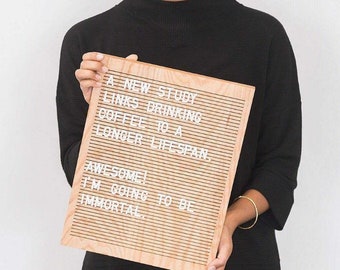 May include: A wooden letter board with white letters spelling out "A NEW STUDY LINKS DRINKING COFFEE TO A LONGER LIFE SPAN. AWESOME! I'M GOING TO BE IMMORTAL."