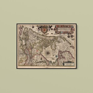 May include: A framed antique-style map of the Zuider Zee region, featuring intricate cartographic details, a central compass rose, decorative heraldic crests, and ornate text blocks in a muted color palette of beige, brown, and faded red tones.
