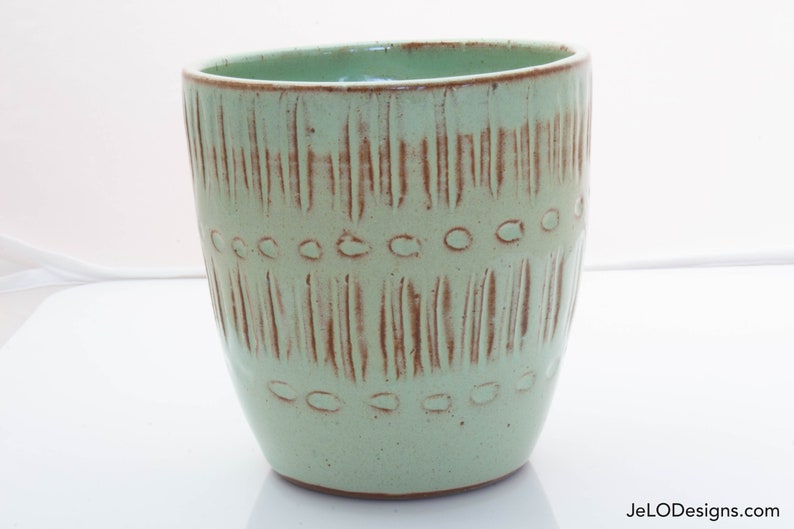 Spring green mug with whimsical carvings image 4