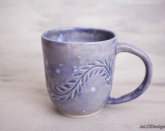 Pale lavender, blue and gold cover these mugs, great for coffee, tea, booze or whatever suits you!