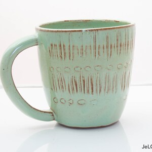 Spring green mug with whimsical carvings image 2