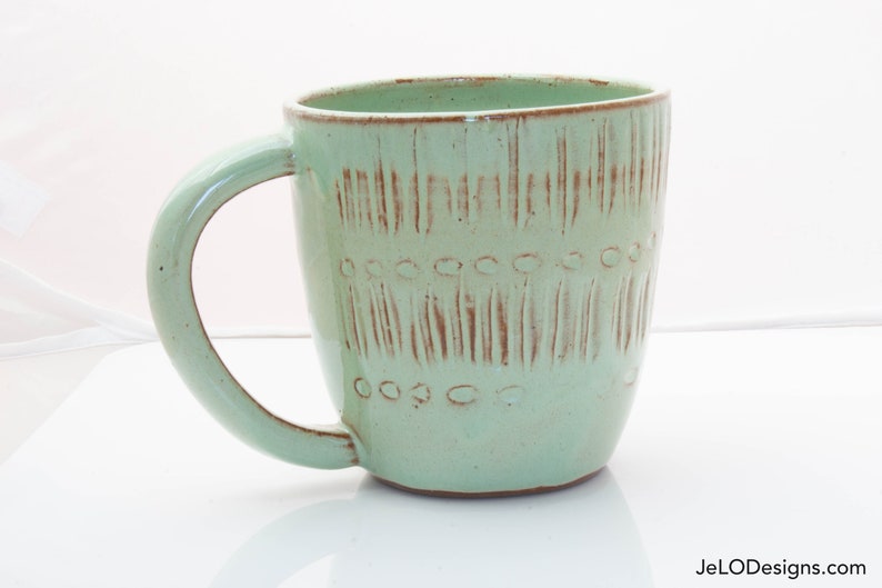 Spring green mug with whimsical carvings image 2