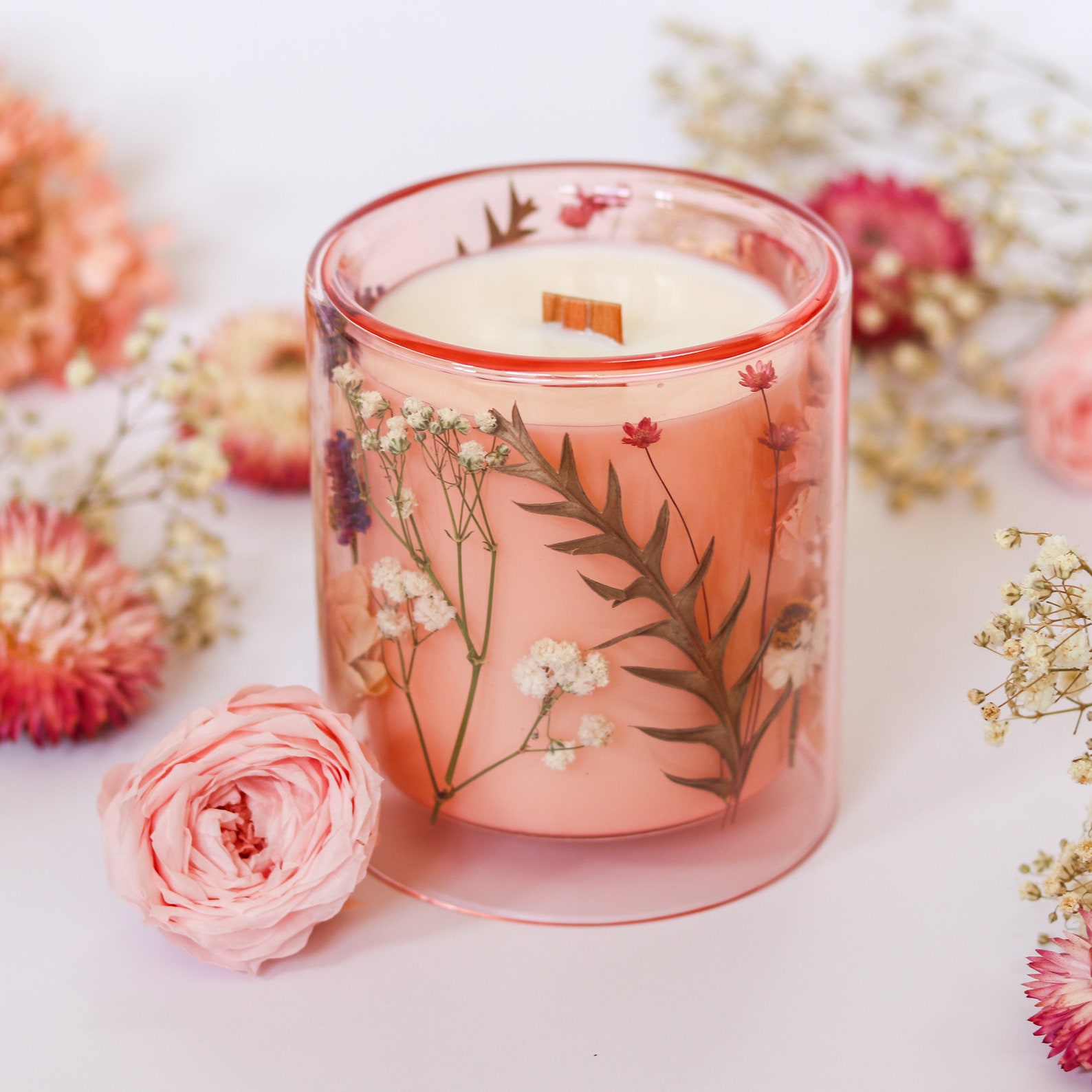 A floral candle in a glass jar