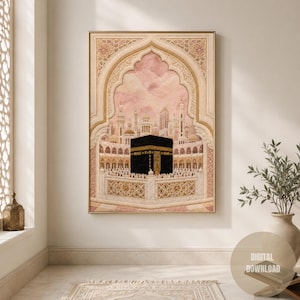 May include: A vertical wall art print featuring a central black Kaaba cube structure surrounded by a white marble courtyard and ornate golden archways. The background displays a soft pink sky with architectural towers and intricate geometric patterns.