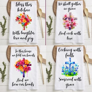 May include: Set of four kitchen towels with a Christian theme. Each towel features a watercolour cross with flowers and a different inspirational quote. The quotes are: "Bless this kitchen with laughter, love and joy", "We shall gather in grace and cook with love", "In this house, we fold our hands and we bow our heads", and "Cooking with faith, seasoned with grace".