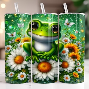 May include: A green frog with a white belly sits on a bed of white and yellow daisies. The frog is surrounded by green leaves and a green background with white sparkles. The image is on a stainless steel tumbler.