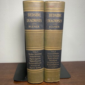 May include: Two vintage hardcover books titled "Bedside Diagnosis" by Blumer. Volume I covers infections, intoxications, dietary deficiency, physical agencies, metabolic diseases, developmental diseases, locomotor and digestive systems. Volume II covers liver and gall bladder, pancreas-peritoneum, bronchi and lungs, mediastinum, circulatory system, blood lymph glands spleen, and urinary system.