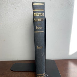 May include: A black book titled "Industrial Electricity" by Dawes, Part I, published by McGraw-Hill Book Company.