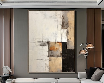 Könnte beinhalten: Abstraktes Gemälde mit geometrischen Formen in Braun-, Beige- und Weißtönen. Das Gemälde ist gerahmt und hängt an einer Wand in einem modernen Wohnzimmer.