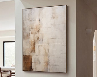 May include: Abstract painting with brown and white tones in a modern living room setting. The painting is hanging on a white wall above a white chair and a wooden stool.