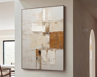 Könnte beinhalten: Abstraktes Gemälde mit weißem Hintergrund und braunen und beigefarbenen geometrischen Formen. Das Gemälde hängt an einer weißen Wand in einem modernen Wohnzimmer.