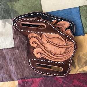 Wearable on belt, leather pocket knife sheath with Western style leather tooling design
