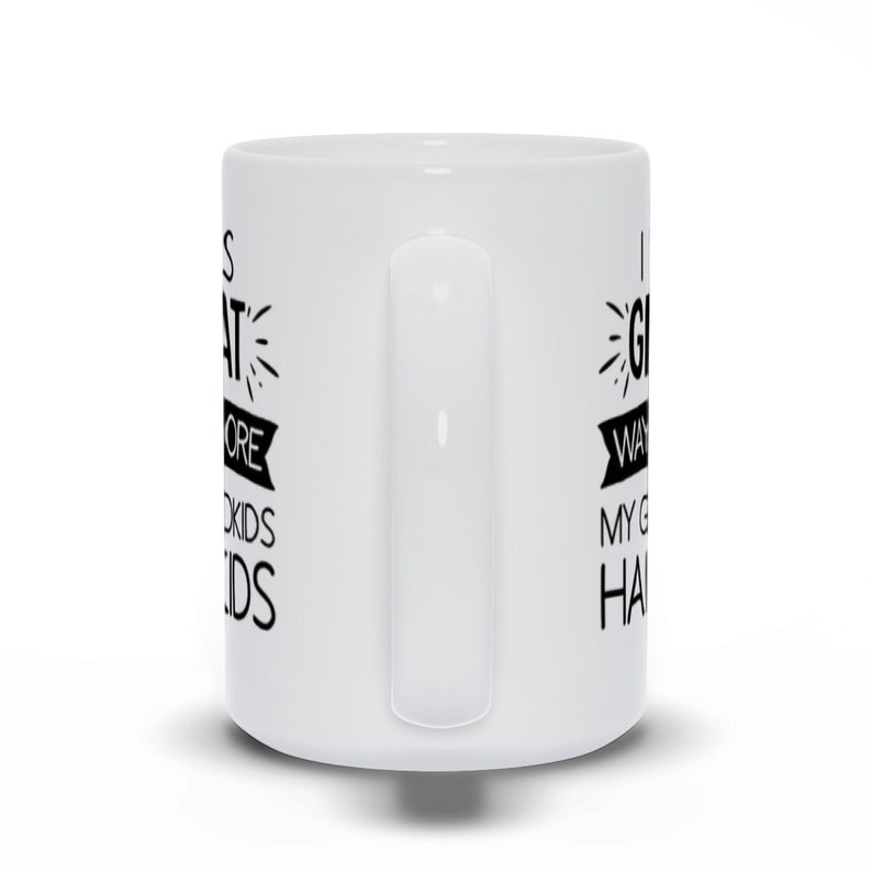 May include: White ceramic mug with black text that reads "It's great to be a grandma, I want to spoil my grandkids, haha".