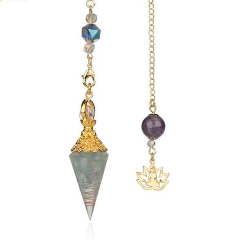 May include: A gold-colored pendulum with a faceted, light blue-green crystal point. The pendulum features a gold-colored chain with a faceted crystal and a gold-colored lotus charm. The pendulum is designed for spiritual practices.